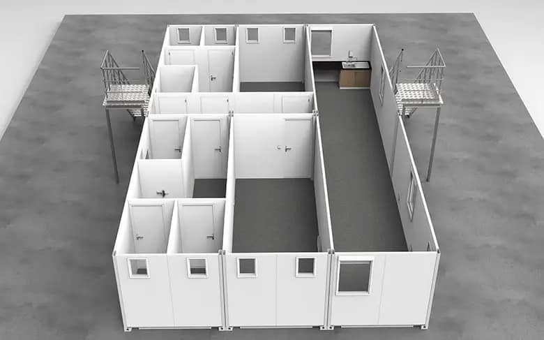 An interior view of a modular office space with partitions forming individual cubicles.