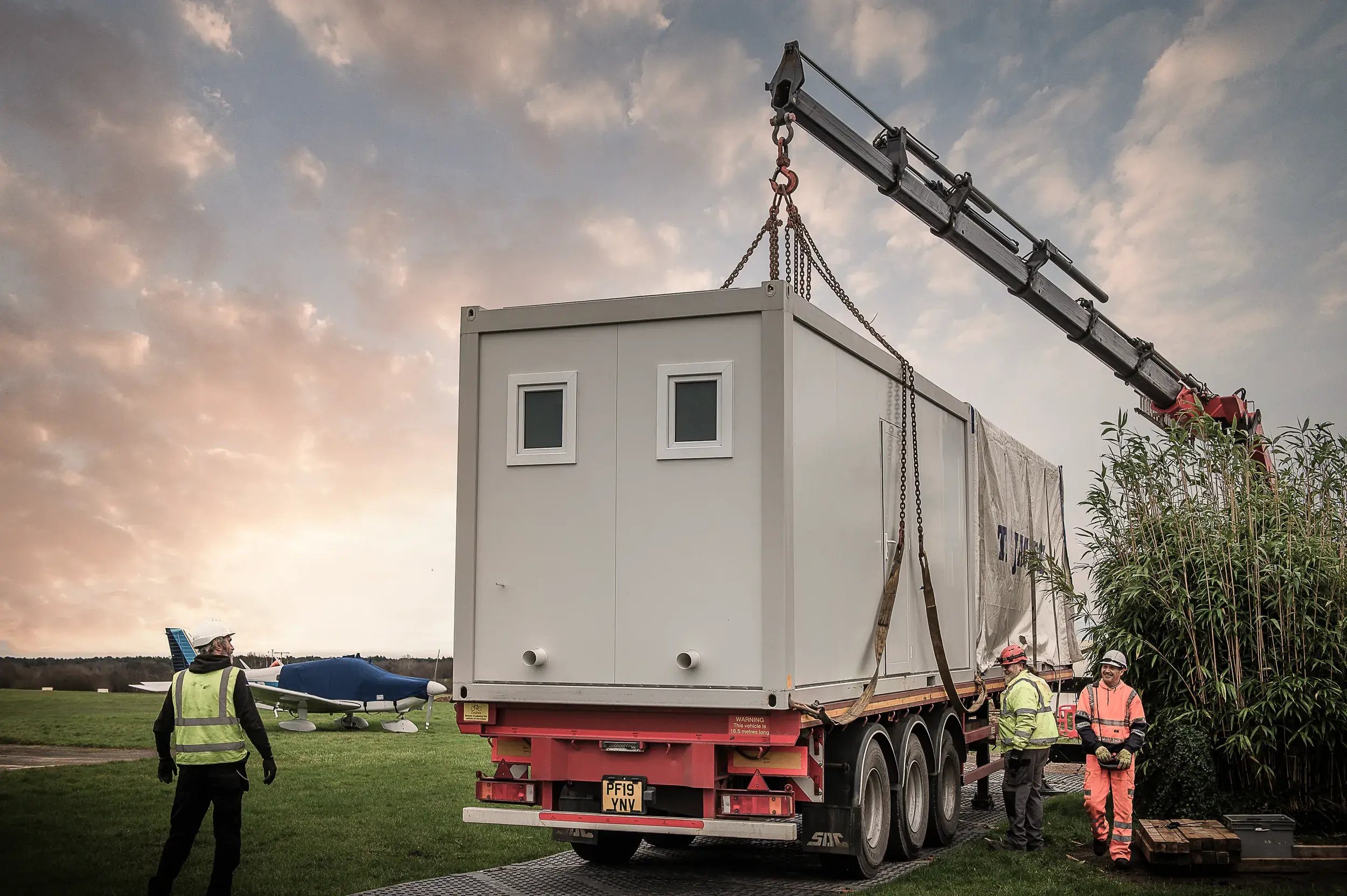 tf-jackson-all-products-delivery-installation-portable-building-unloaded-from-lorry-as-workers-supervise