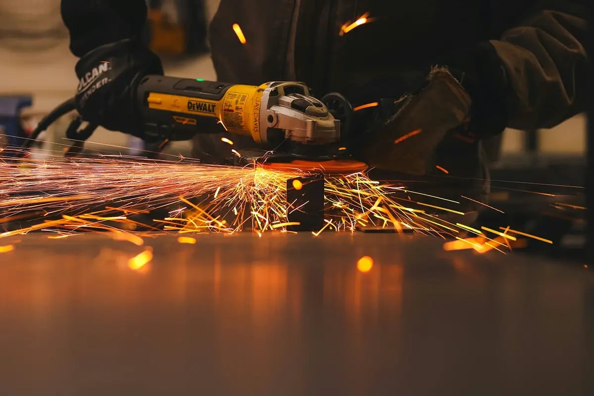 tf-jackson-all-products-worker-uses-angle-grinder-to-refurbish-modular-buildng