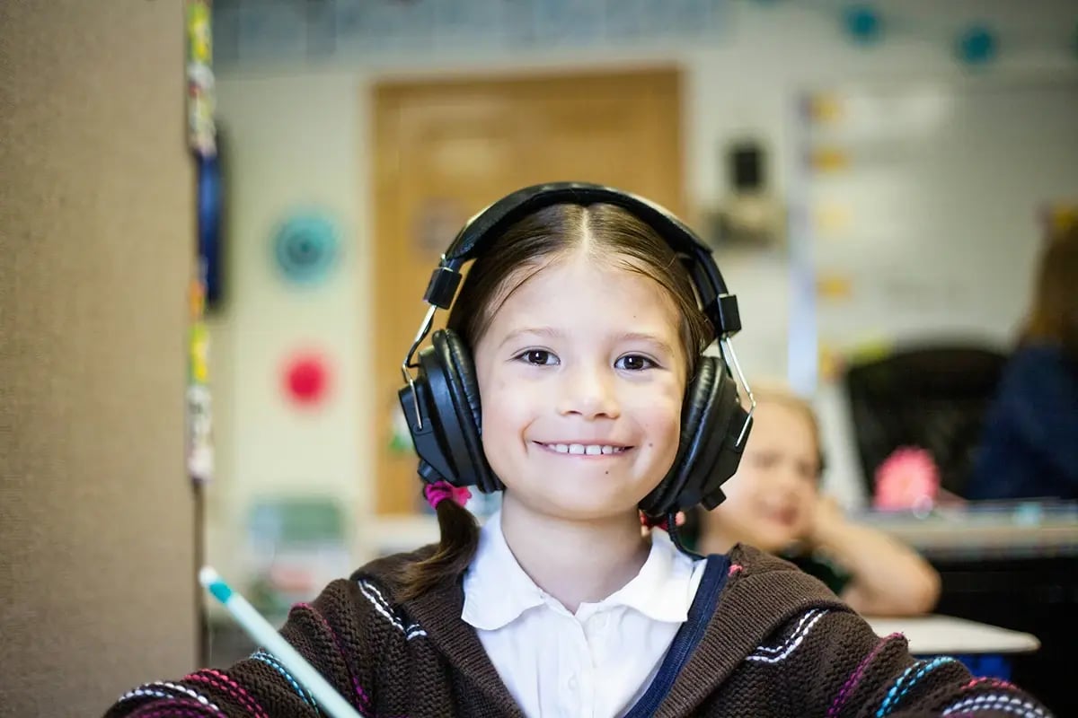 tf-jackson-education-young-student-in-modular-classroom-with-headphones