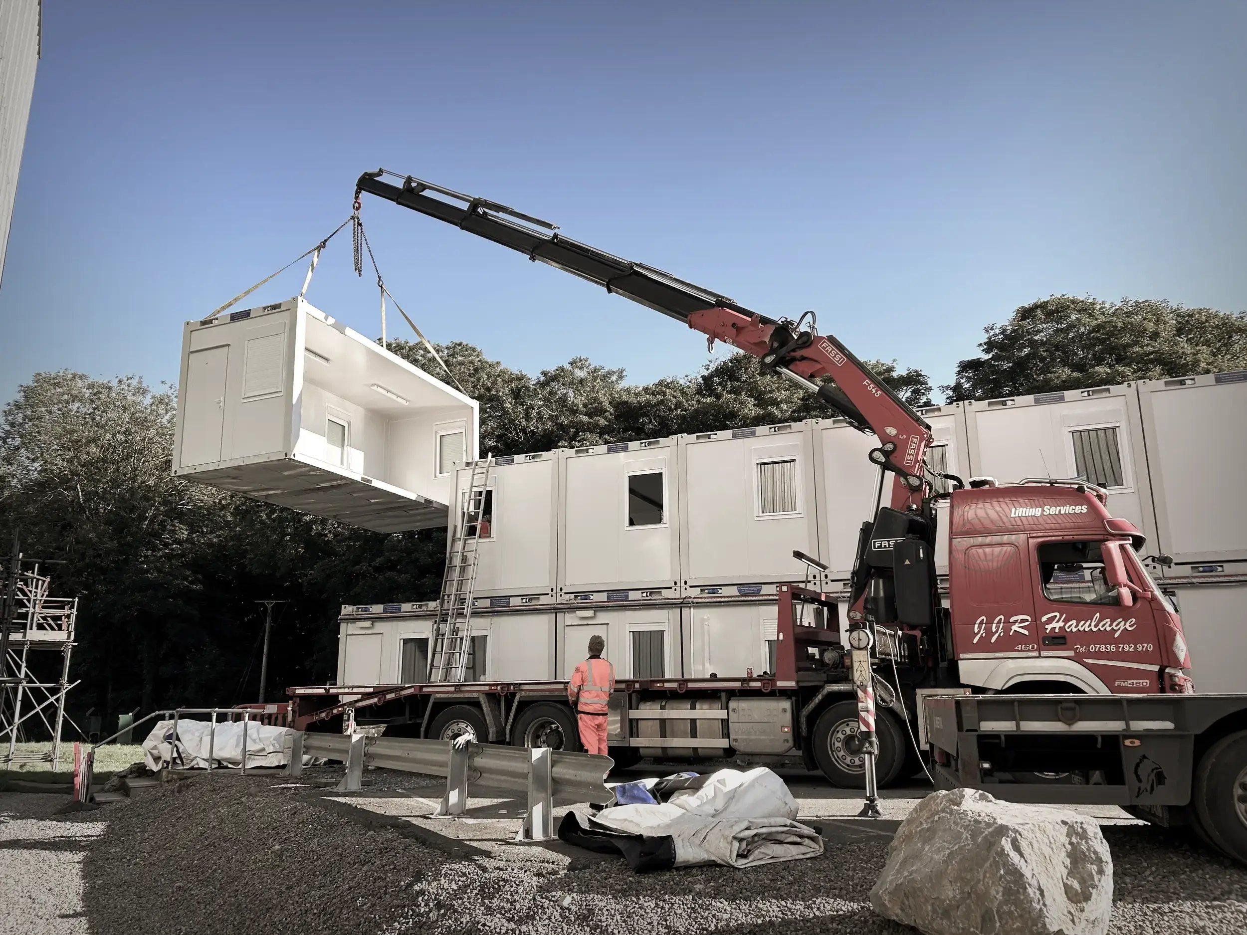 tf-jackson-framework-supply-red-lorry-delivers-portable-modular-building-and-installs-on-site