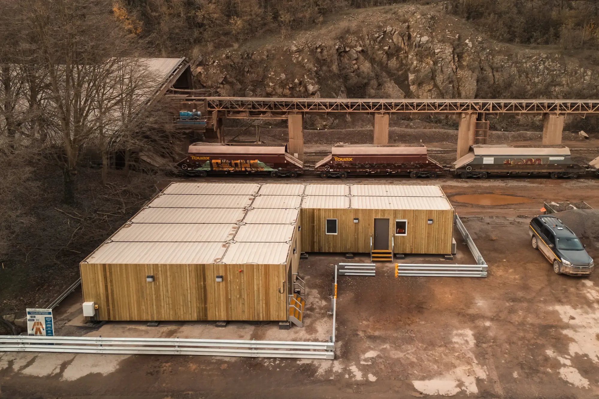 tf-jackson-used-buildings-project-support-portable-buildings-at-quarry-site-with-train