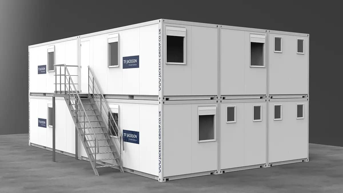 Two-story modular building with external stairway, featuring T.F. Jackson branding.