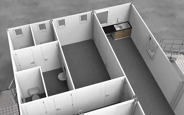 Interior view of a modular building showing partitioned rooms with a kitchenette and a restroom